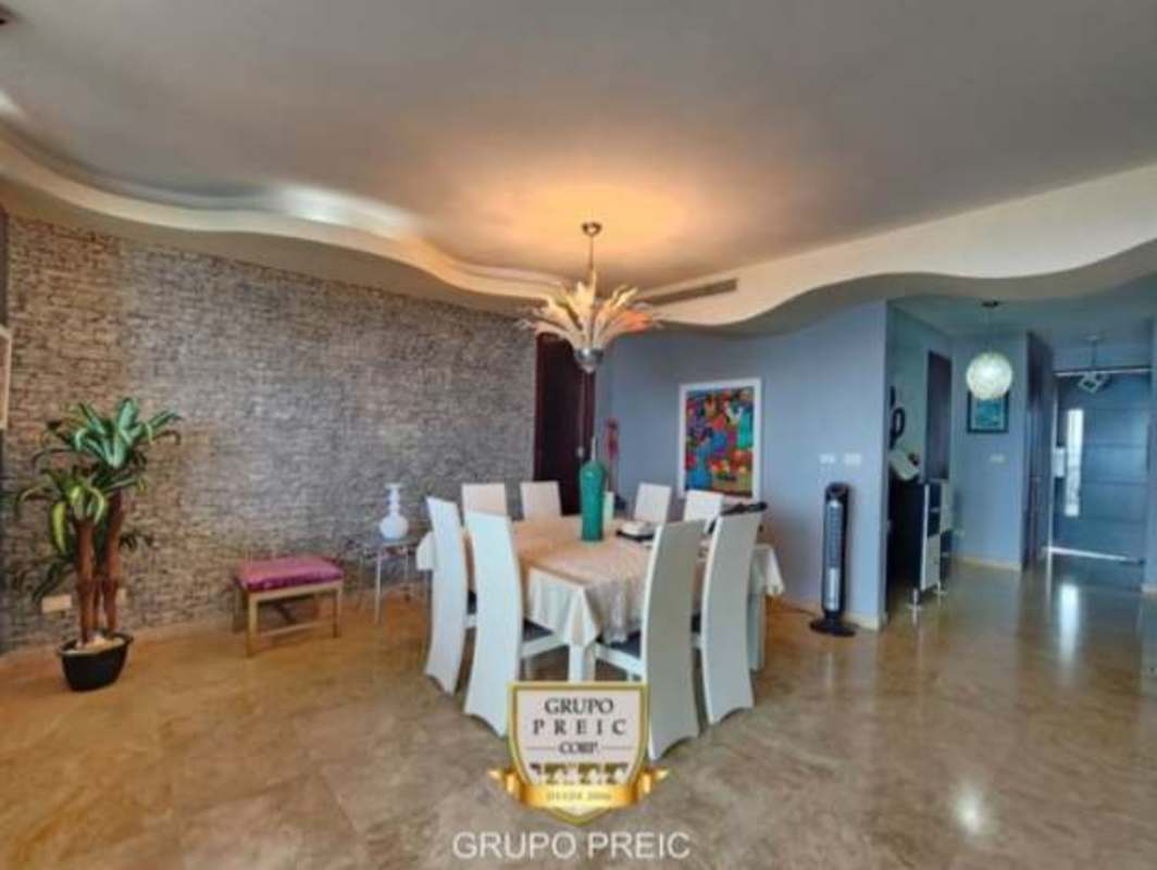 Contemporary dining room with stone wall and modern design in PH Pearl Costa del Este Panama