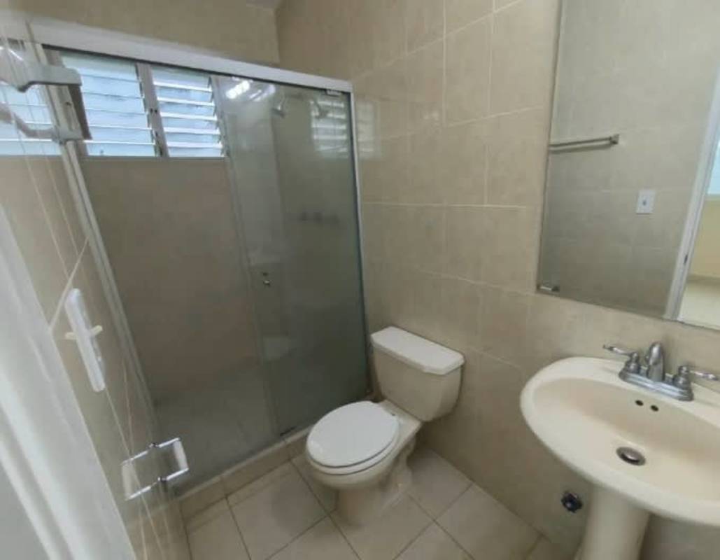 Contemporary bathroom with tile walls, glass shower, pedestal sink, PH Edison Park Panama