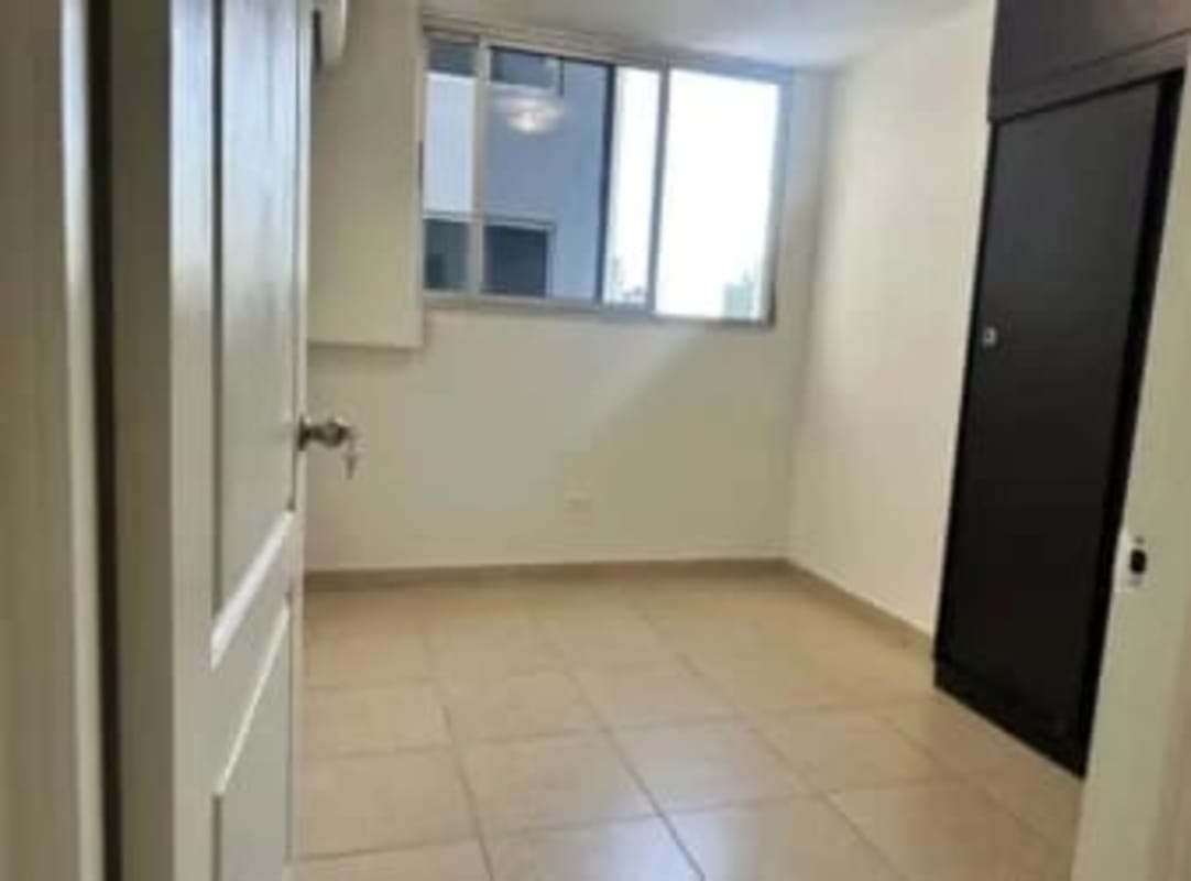 Modern tiled bathroom with shower and ceramic fixtures in Bella Vista condo Panama City