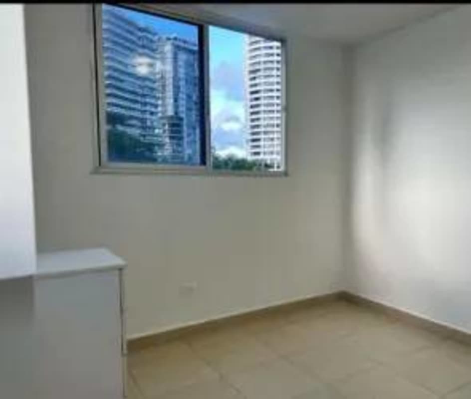 Spacious living and dining room with balcony access in Bella Vista Panama apartment