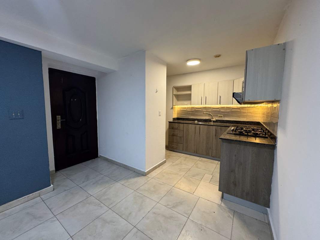 Remodeled kitchen with granite countertops, cabinets, and gas stove at PH Mystic Blue Llano Bonito
