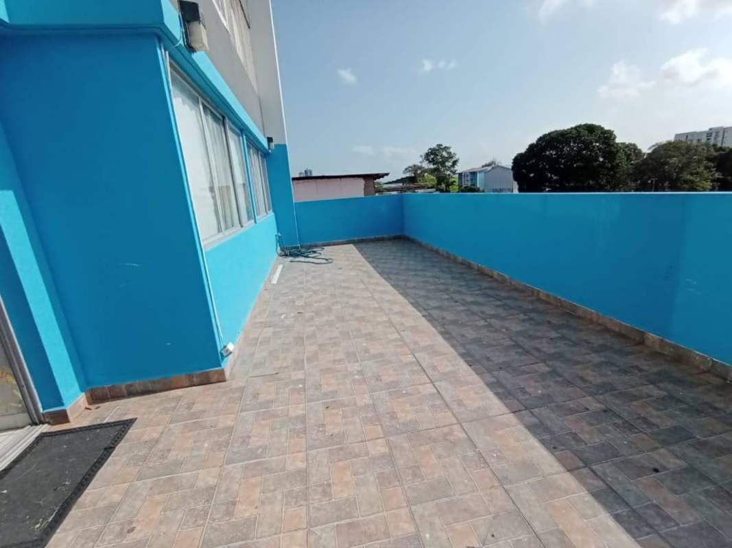 Spacious private terrace with bright blue painted walls at PH Central Park Panama City.