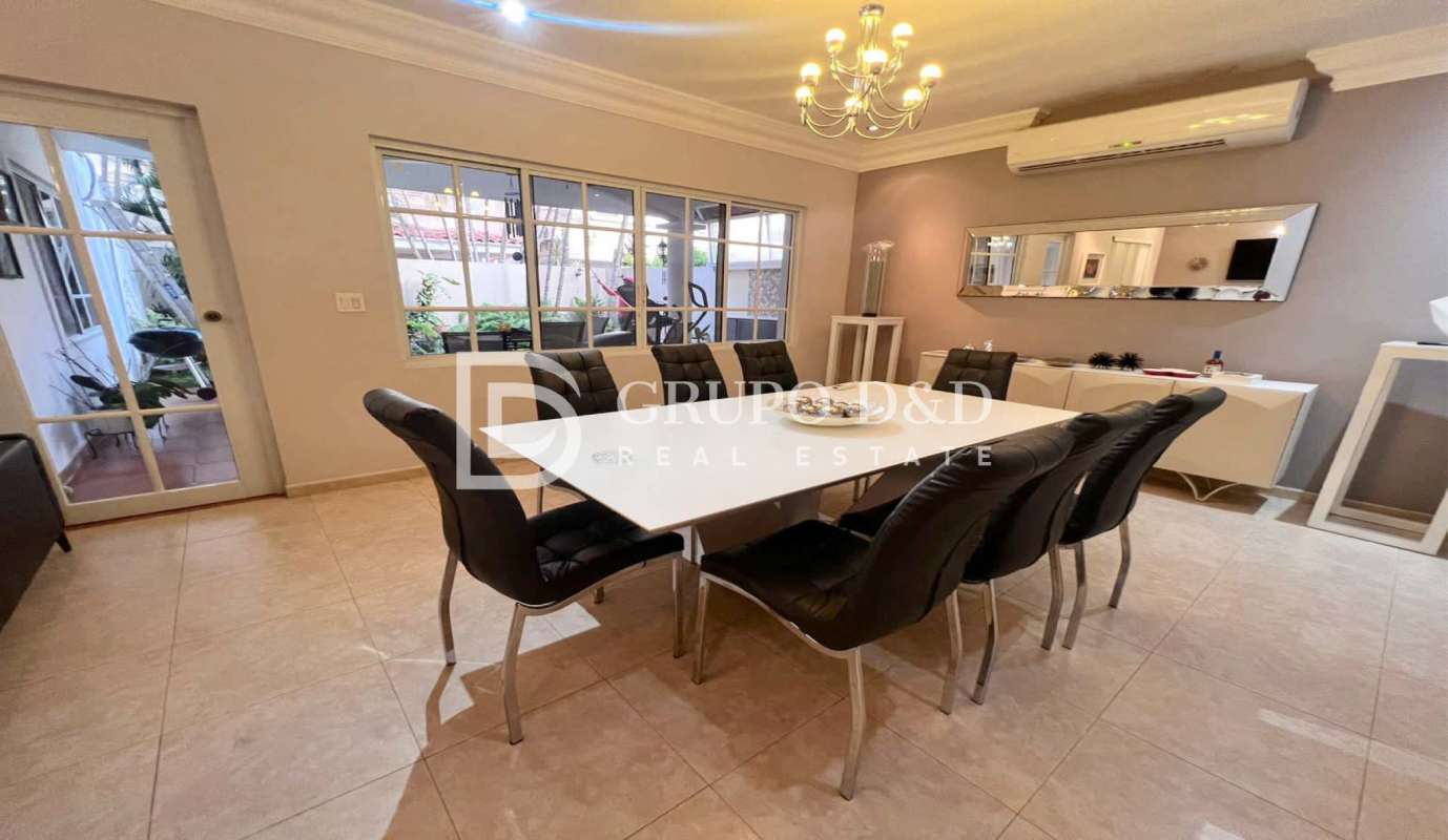Elegant dining room with chandelier, glass doors to terrace in Palmeras del Este Costa del Este