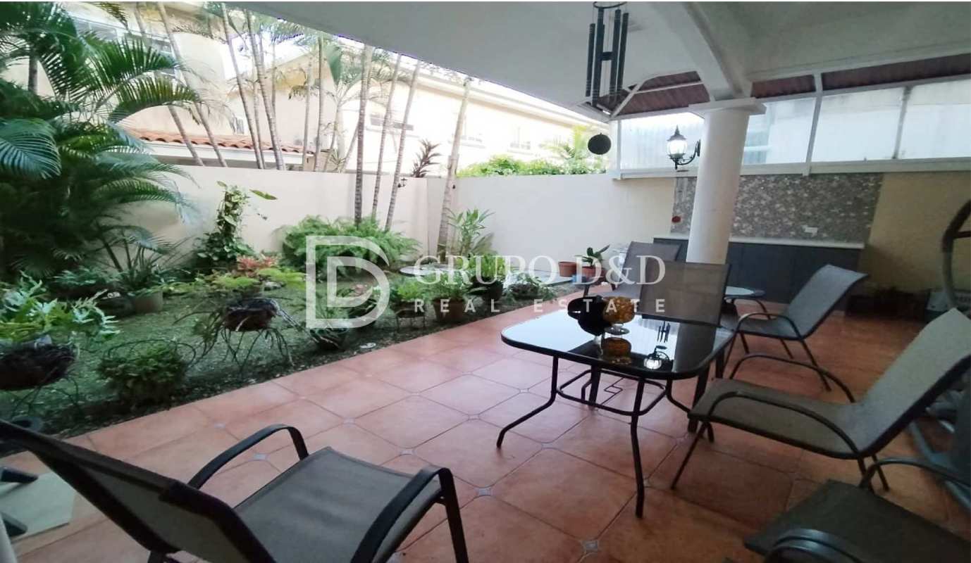 Outdoor patio area with tiled floor and garden Palmeras del Este Panama