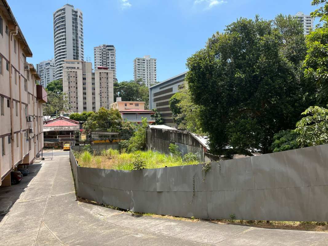 Empty grassy fenced city lot perfect for apartment or mixed-use complex Panama Perejil