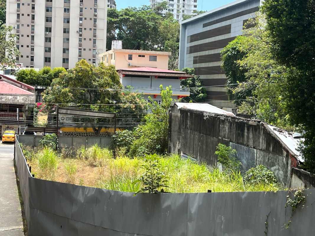 Vacant fenced land surrounded by high-rise and mid-rise apartments ideal for real estate development Panama City