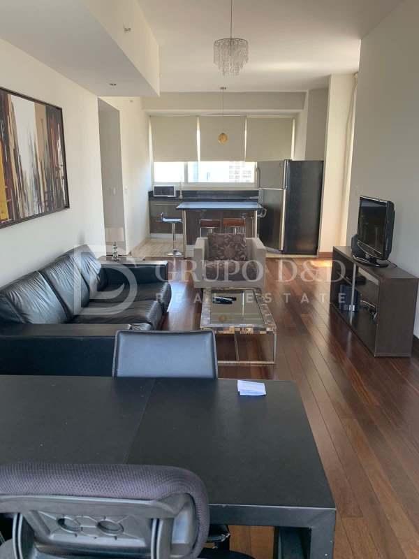 Modern kitchen with granite countertop, appliances and large window in PH Denovo Obarrio