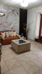 Cozy living room with sofa, coffee table and decor furnished apartment Colón