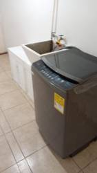 Laundry room with washing machine and utility sink Barrio del Maestro Colón
