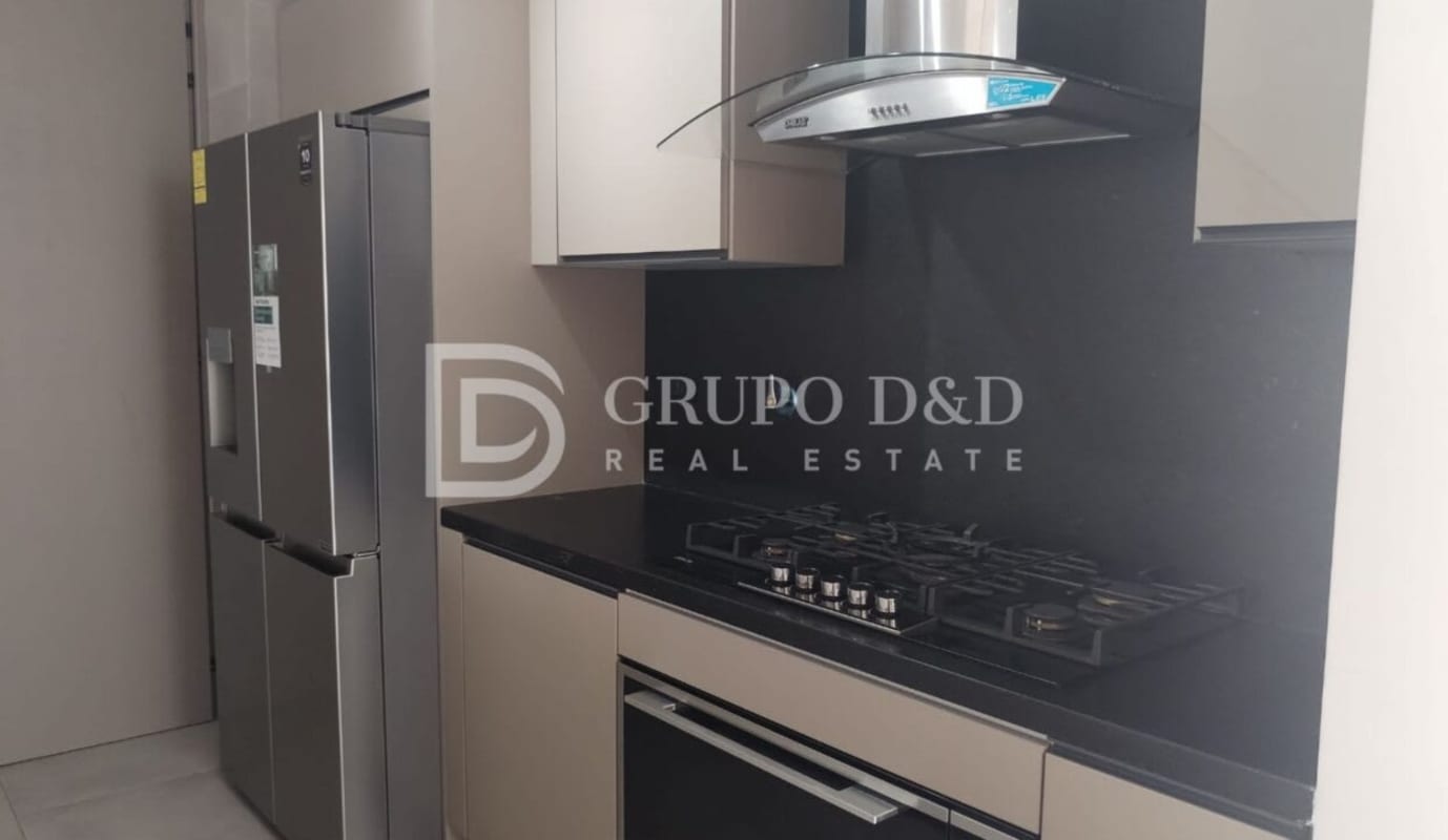 Stylish kitchen with black countertops, stainless appliances in PH Victory Wellness Coco del Mar Panama City