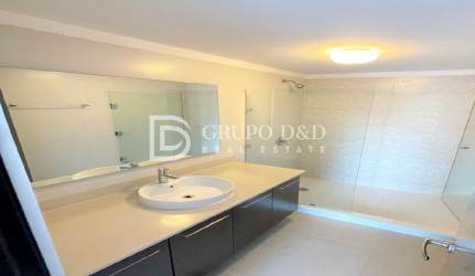 Modern bathroom with glass shower and tile Mosaic Apartments Panama Pacifico
