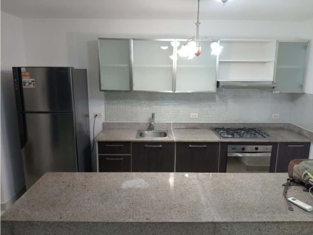 Kitchen with granite countertops stainless steel refrigerator gas stove in PH Miró Panama