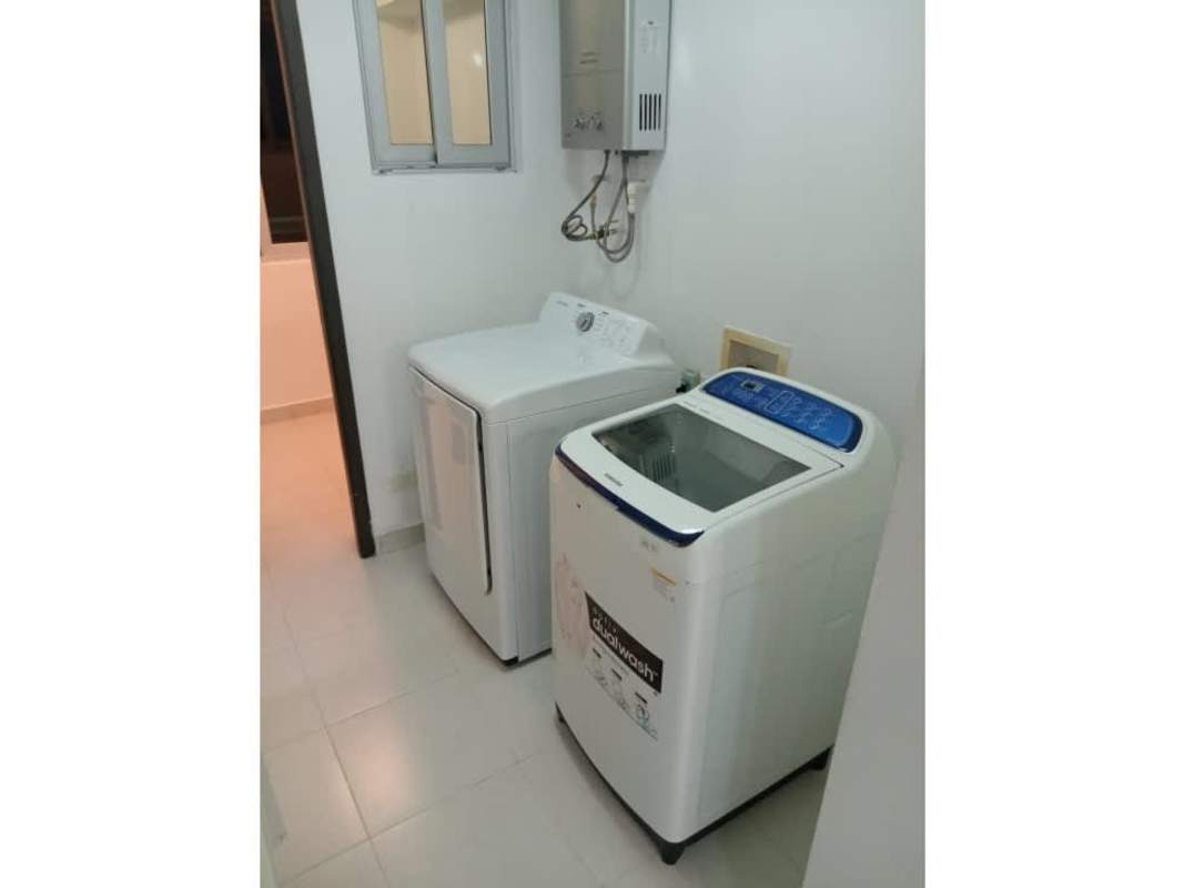 Laundry with washer dryer water heater tiled floors PH Miró Panama City