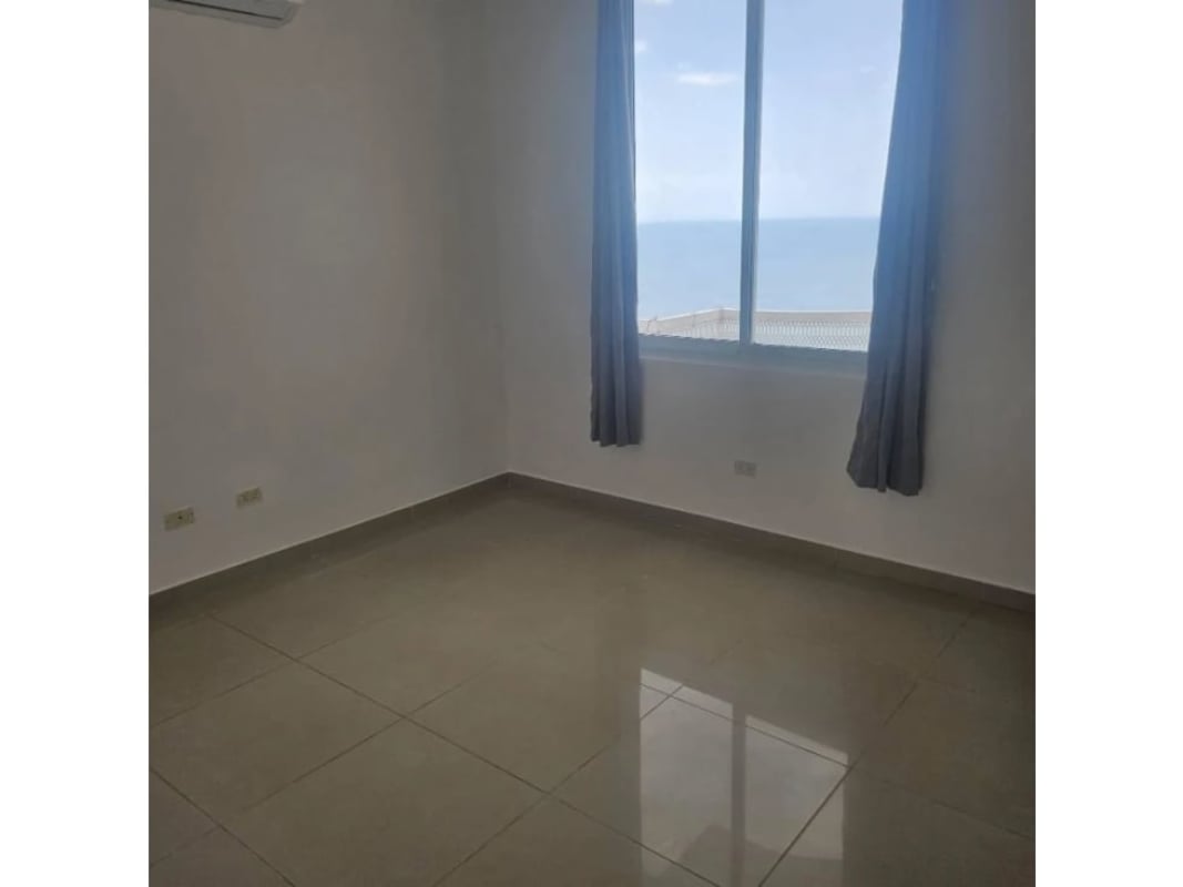 Light-filled living area with ceramic floors and ocean view balcony PH Ocean Drive Punta Pacifica Panama