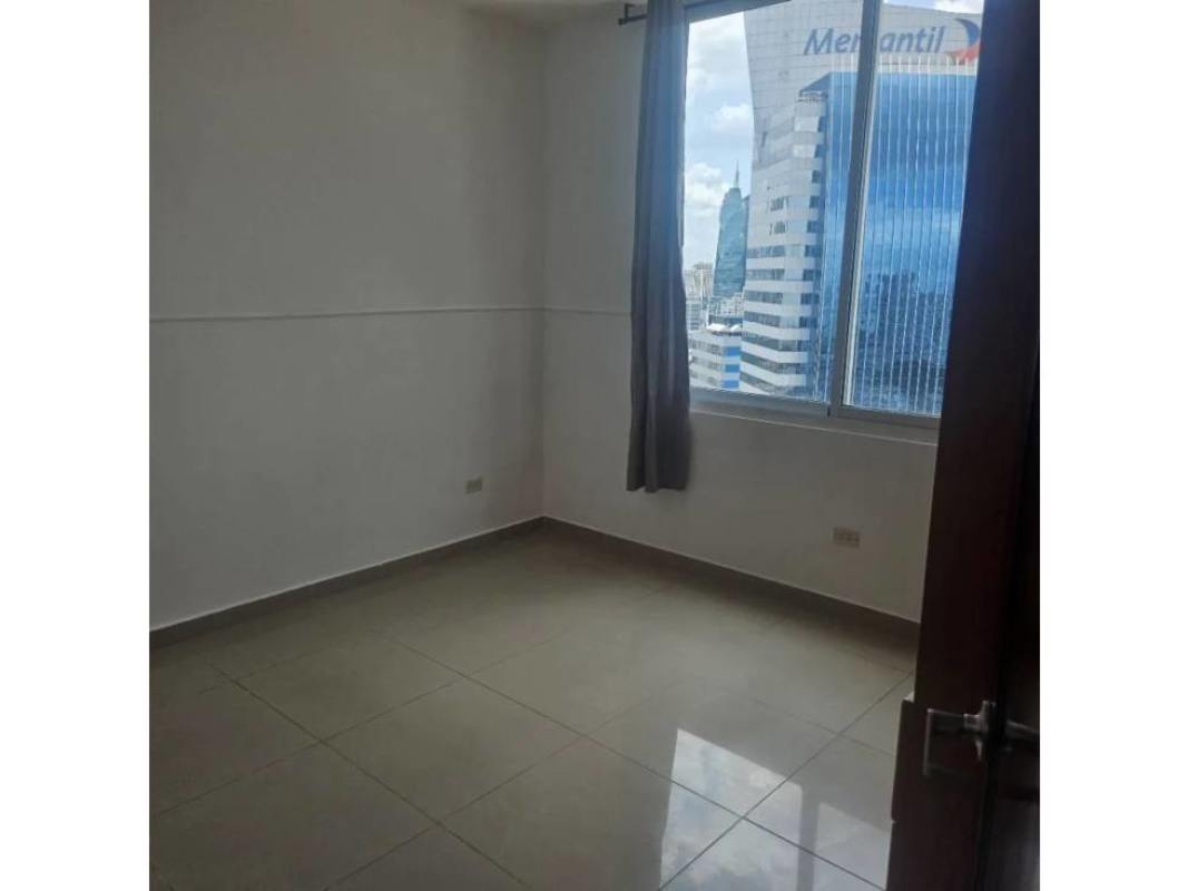 Bedroom with windows offering cityscape and ocean views PH Ocean Drive Panama