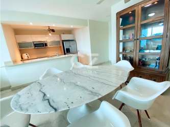 Open-plan dining and living room with balcony ocean view PH Casa Bonita Panama