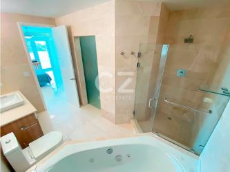 Elegant bedroom with ocean views and ensuite jacuzzi bathroom in PH Casa Bonita Panama