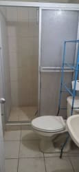 Bathroom with shower enclosure, sink and toilet in Lago Emperador house for rent
