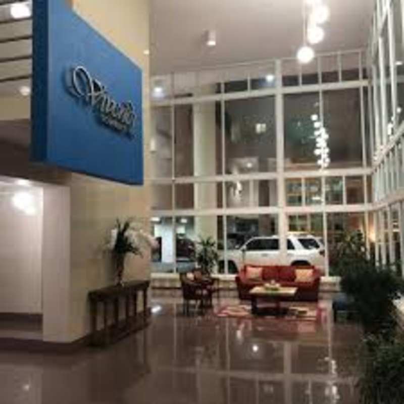 Bright modern gym with large windows city view and fitness equipment at PH Edison Park Panama