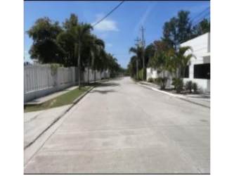 Minimalist house exterior with privacy windows in PH Ibiza Playa Village beach community Panama