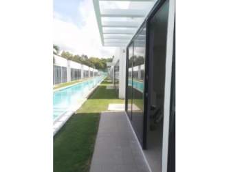 Kitchen with granite breakfast bar and cabinets in beach house PH Ibiza Playa Village Panamá