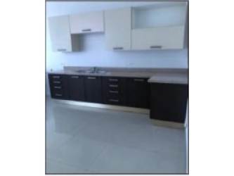 Modern dark cabinet kitchen with large windows and laundry area PH Astoria Panama City