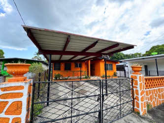Living room with tiled floors, curtains, and furniture in Chame house for sale