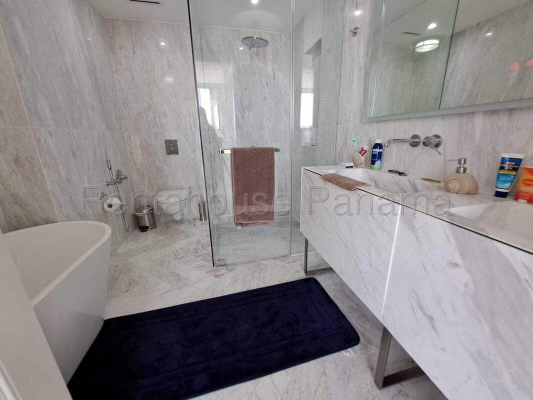 Luxury bathroom with marble finishes and glass shower PH Quartz Tower San Francisco Panama