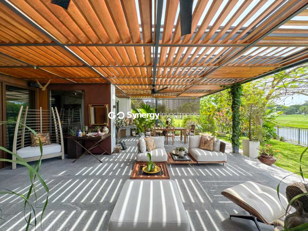 Large terrace with transparent roof and garden overlooking lake in Santa Maria Panama