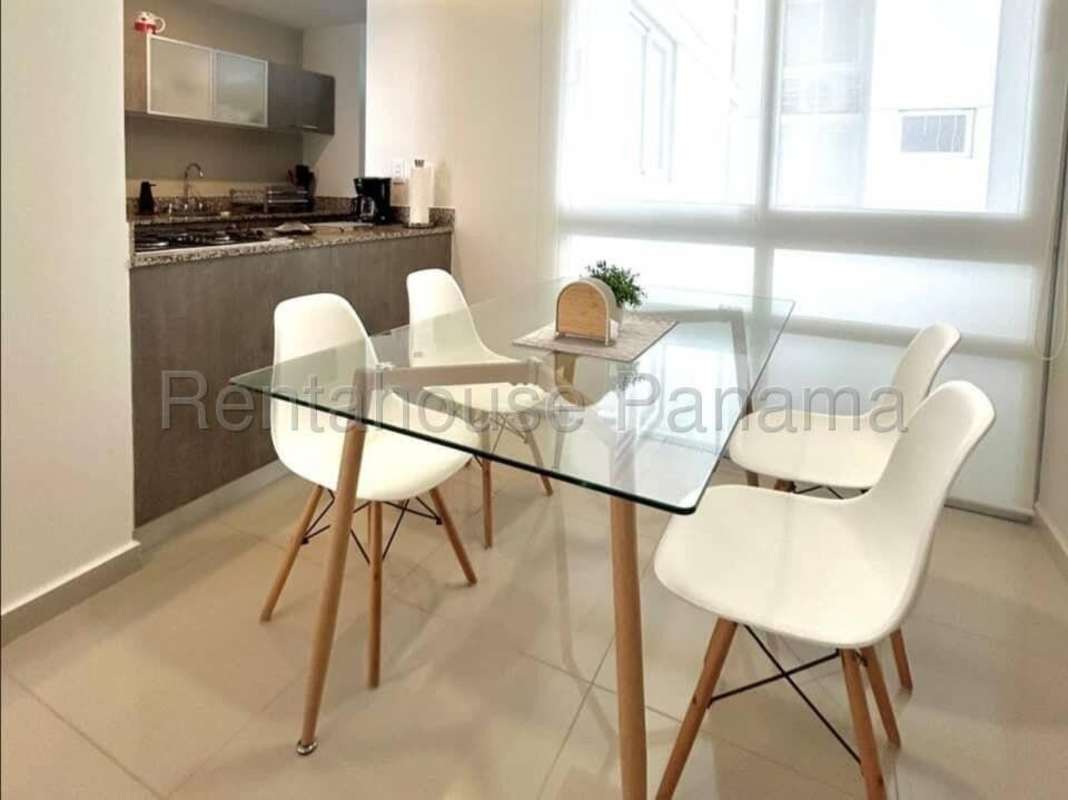 Dining area next to open kitchen furnished apartment Costa del Este