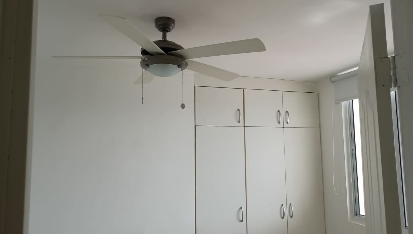 Bedroom with ceiling fan, built-in wardrobe, roller blinds in PH Dos Mares View II Betania Panama City