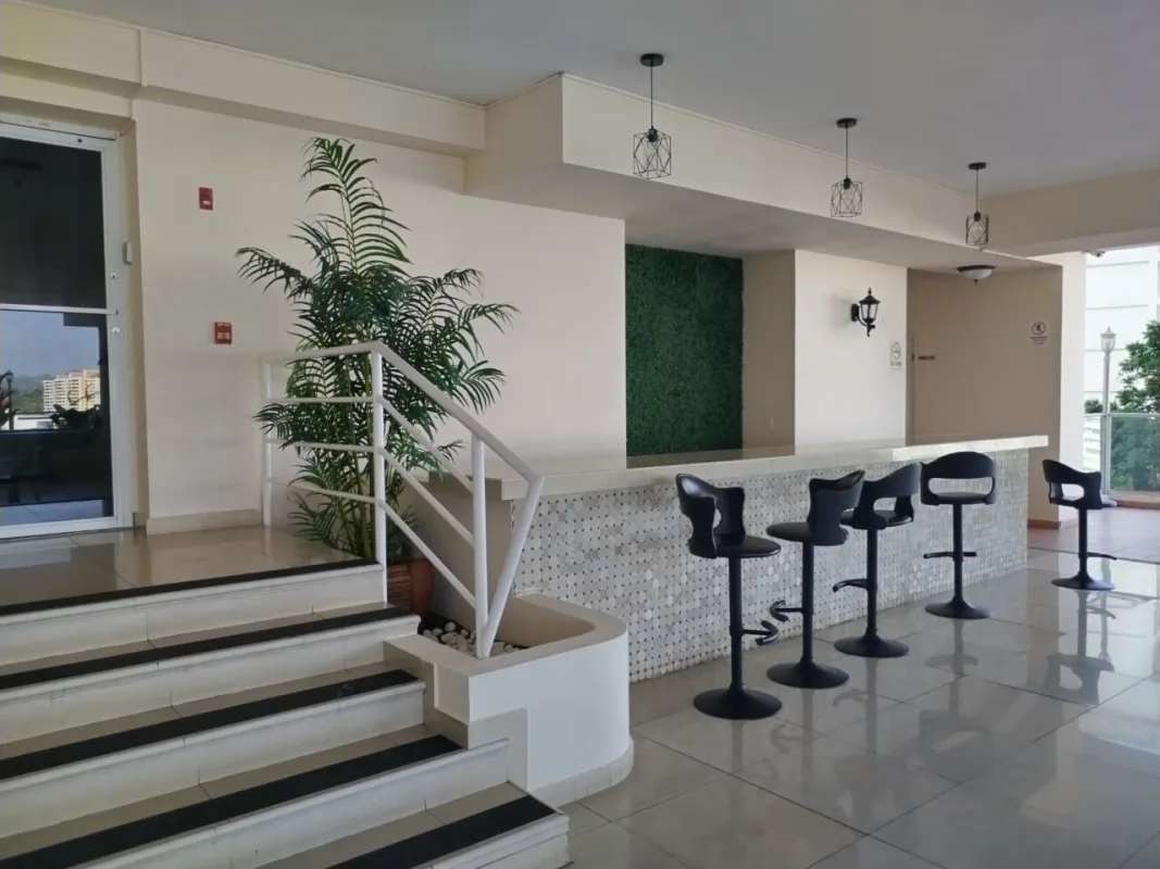 Indoor lounge area with mosaic bar stools pendant lighting PH Dos Mares View Betania Panama