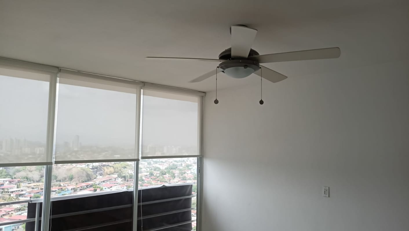 Bright bedroom with floor-to-ceiling windows and city skyline view PH Dos Mares View Betania Panama