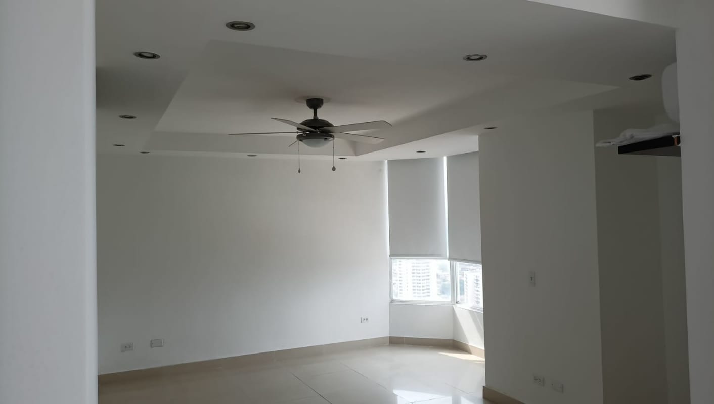 Living room with ceiling fan recessed lighting and large window PH Dos Mares View Betania Panama