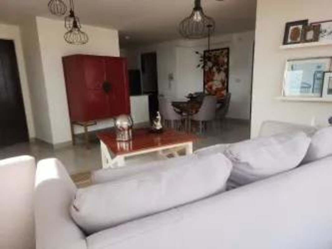 Primary bedroom with large window, closet and porcelain floors in PH Villa de las Fuentes Panama rental apartment