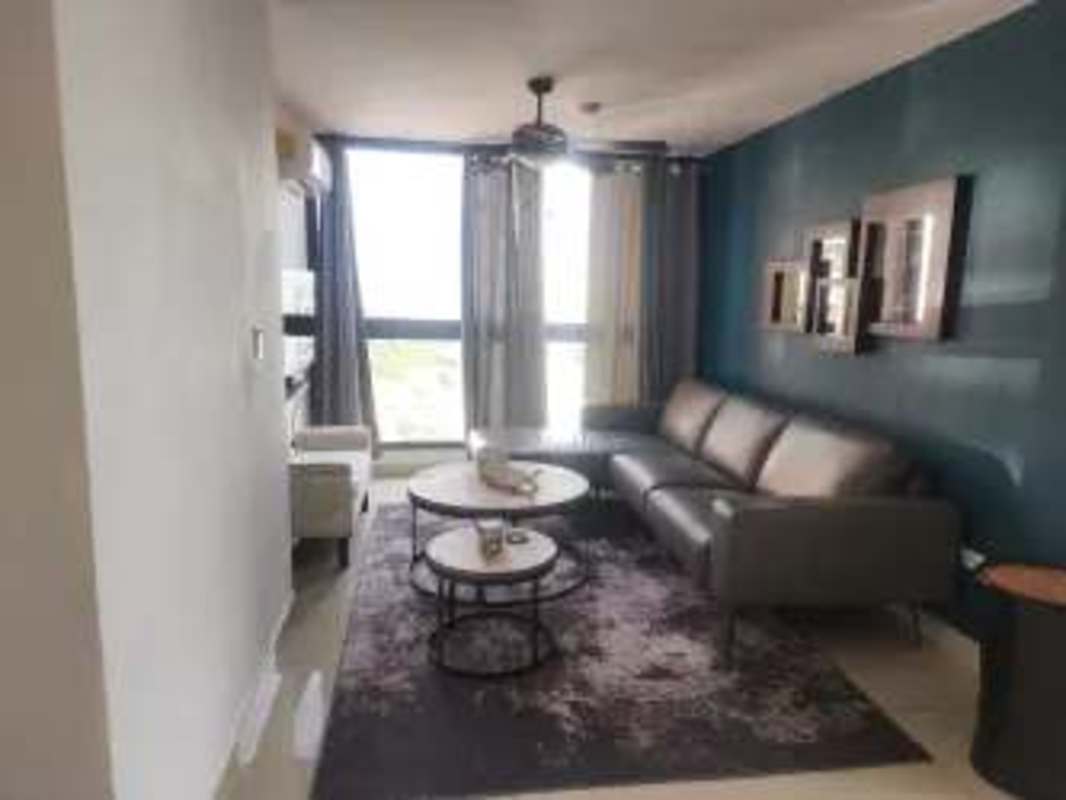Secondary bedroom with porcelain tile flooring, closet and large window PH Villa de las Fuentes Panama