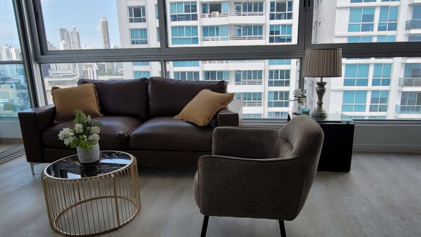 Glass dining table and large window city view PH Bayfront Avenida Balboa