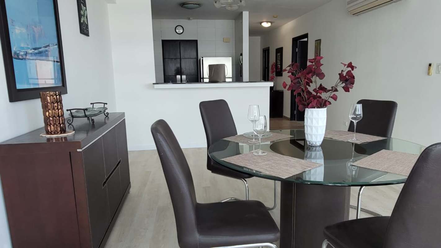 Contemporary dining area with view into kitchen and city views PH Bayfront