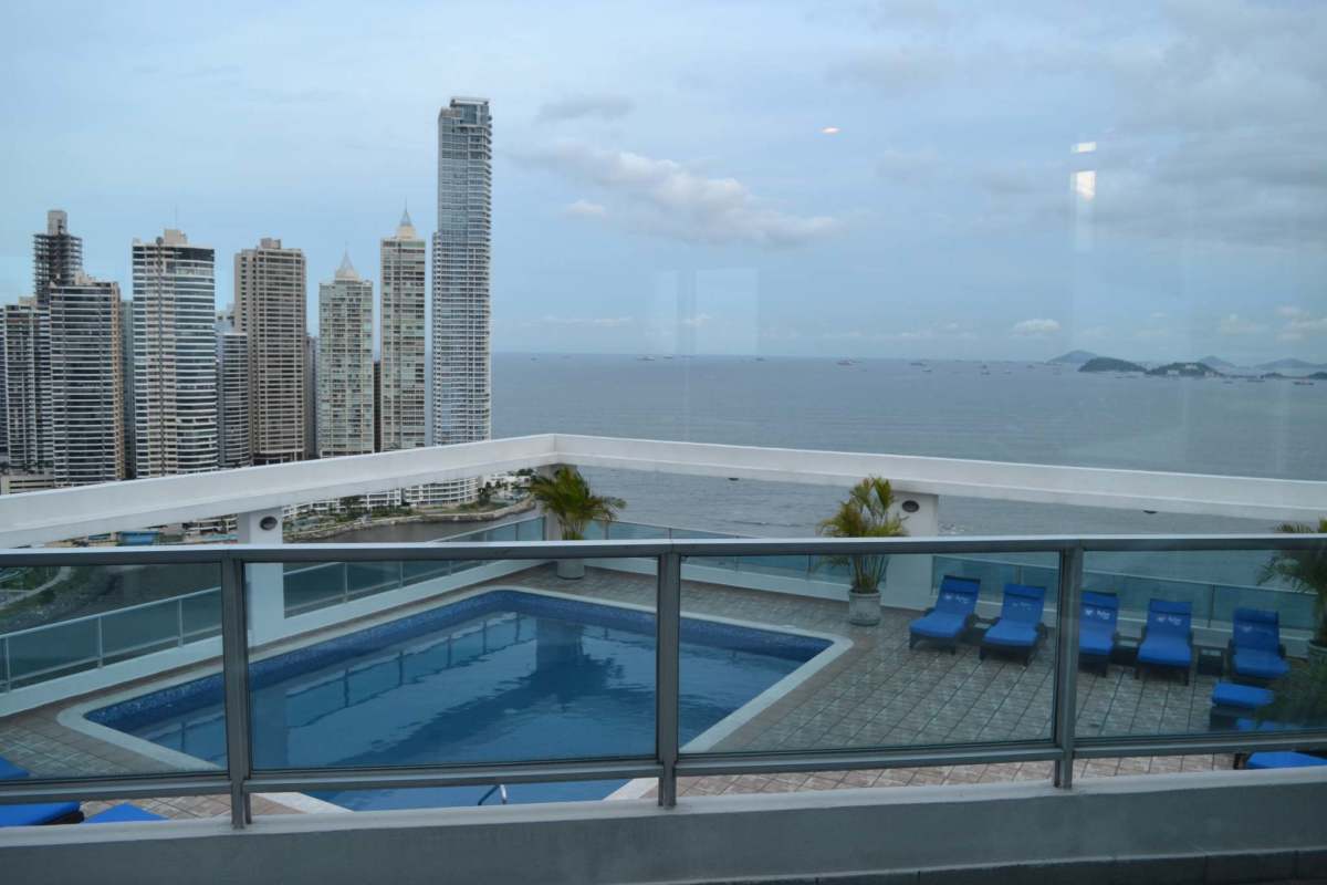 Infinity rooftop pool overlooking Panama Bay and city skyline PH Bayfront