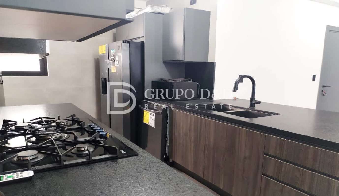 Kitchen with island, black counters, appliances in PH Victory Sport Coco del Mar Panama