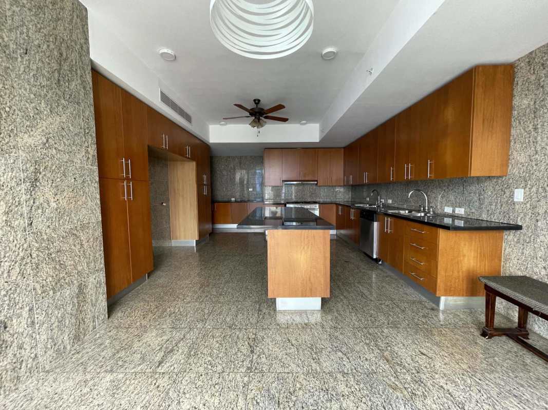 Open concept living and dining connected with modern kitchen at PH The Point Punta Paitilla Panama