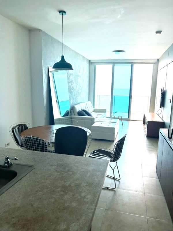 Granite countertop kitchen with stainless appliances in PH H2O Avenida Balboa Panama City