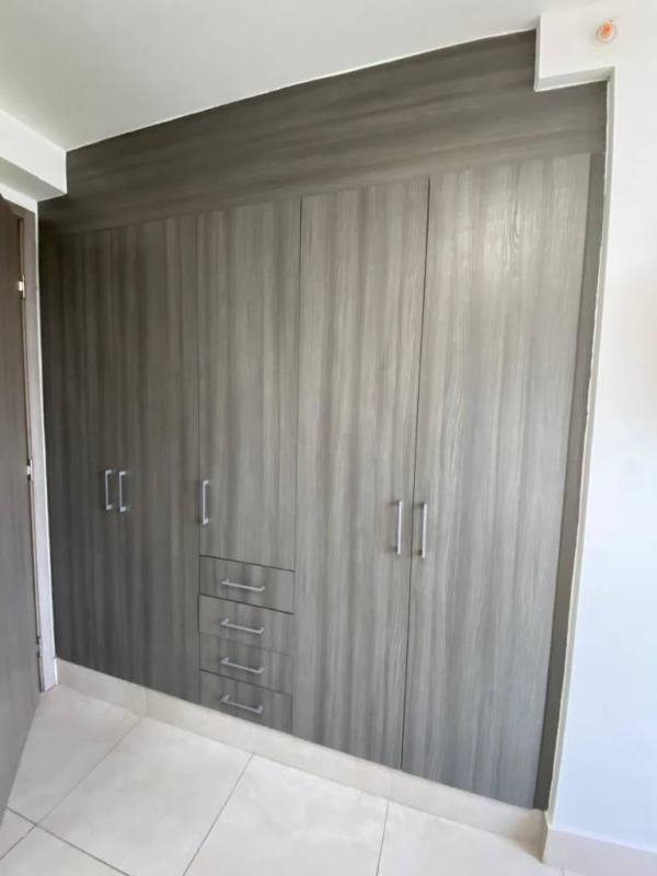 Contemporary galley kitchen granite counters stainless appliances PH Luxor El Cangrejo Panama