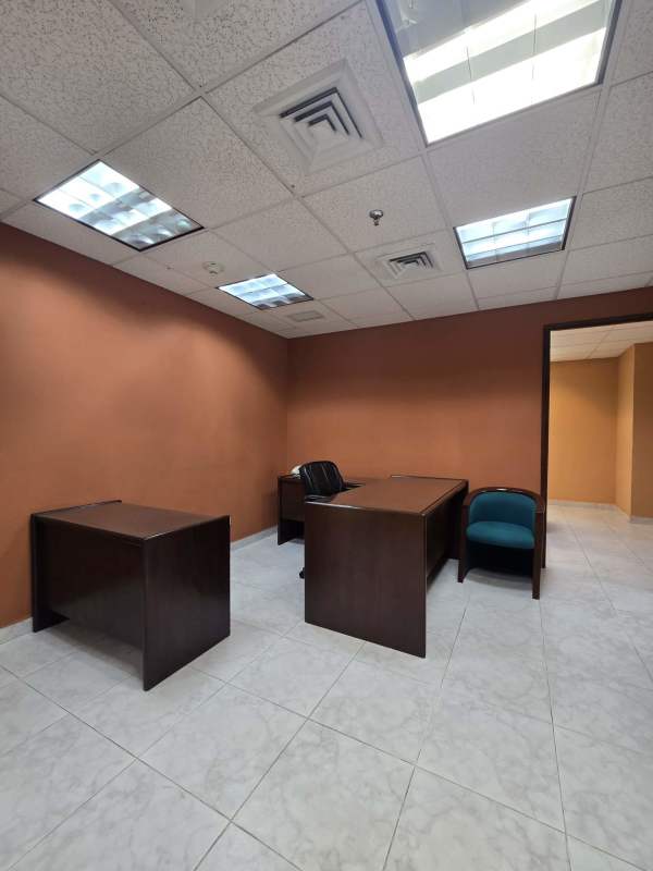 Ample executive office space with desks and conference table in World Trade Center Panama for sale