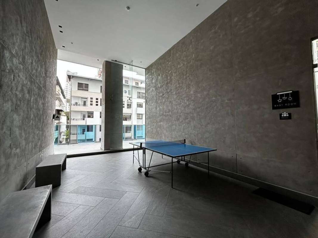 Recreation room with ping pong table, glass walls at PH Velure Panama City