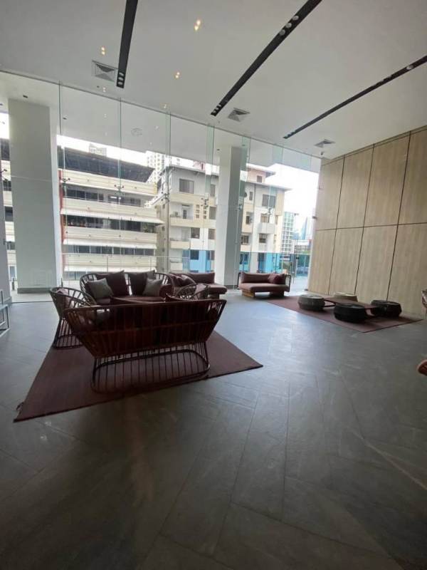 Spacious modern lobby with ceiling windows, designer furniture in PH Velure Panama