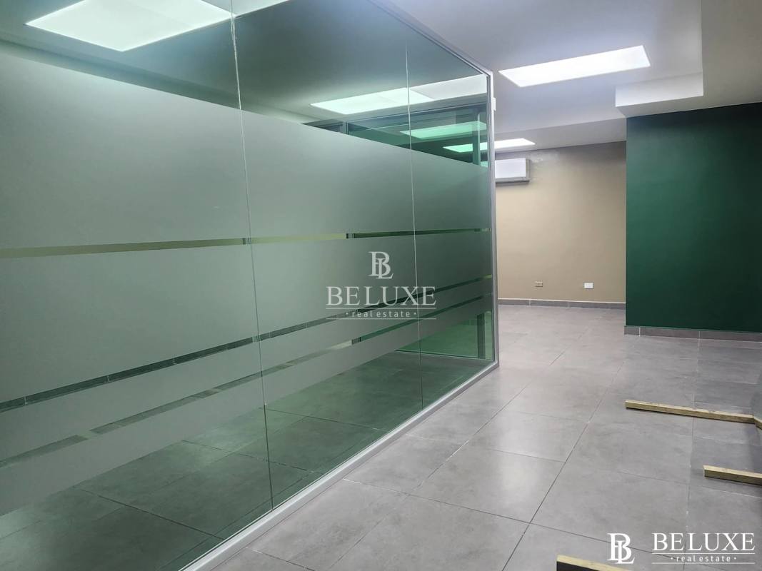 Commercial property for lease with gray tiled floor, glass partitions, San Francisco Panama