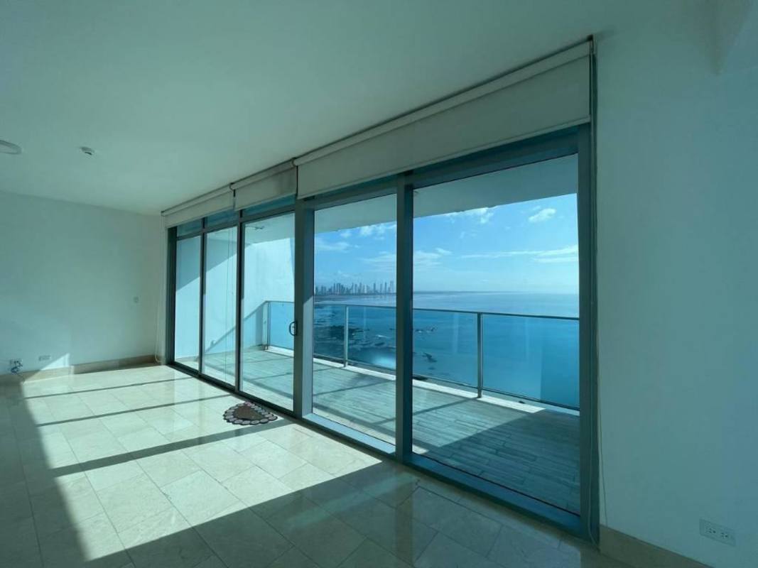 Open concept living room with panoramic sea views, balcony access Grand Tower Panama