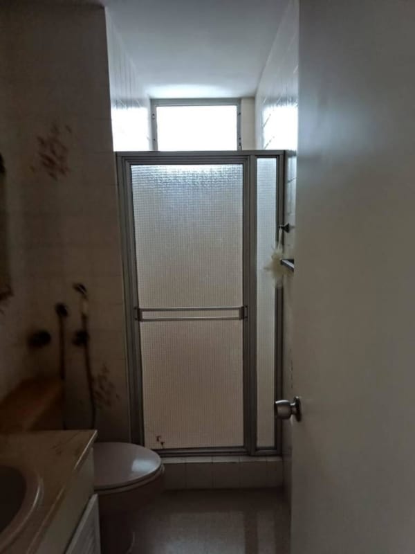 Bright living room with panoramic city view and balcony access in PH Royal Park Obarrio