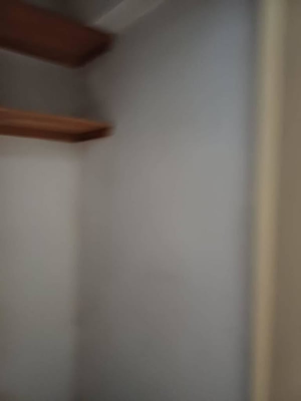 Bedroom with city view, large windows, and built in closet in PH Royal Park Obarrio